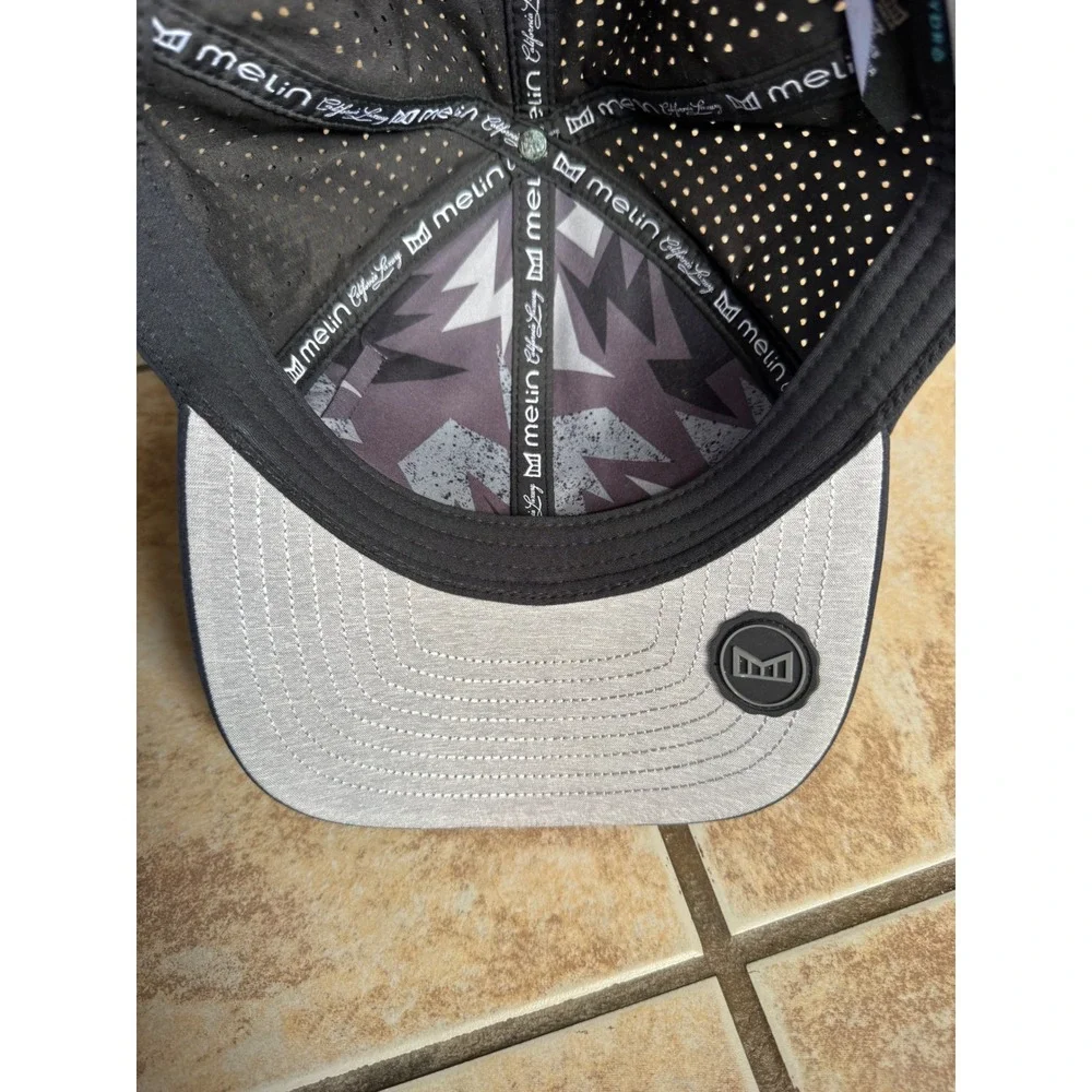Melin A-Game Hydro Black Performance Snapback Hat 60cm L/XL Water Resistant